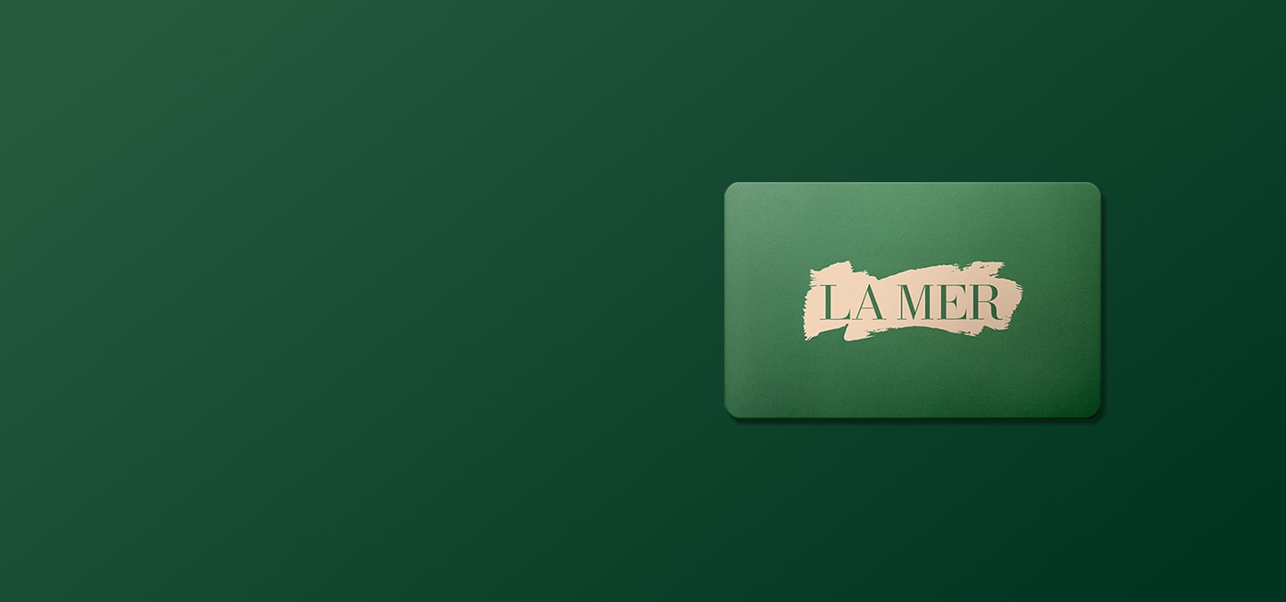 La Mer green gift card over a green gradient background