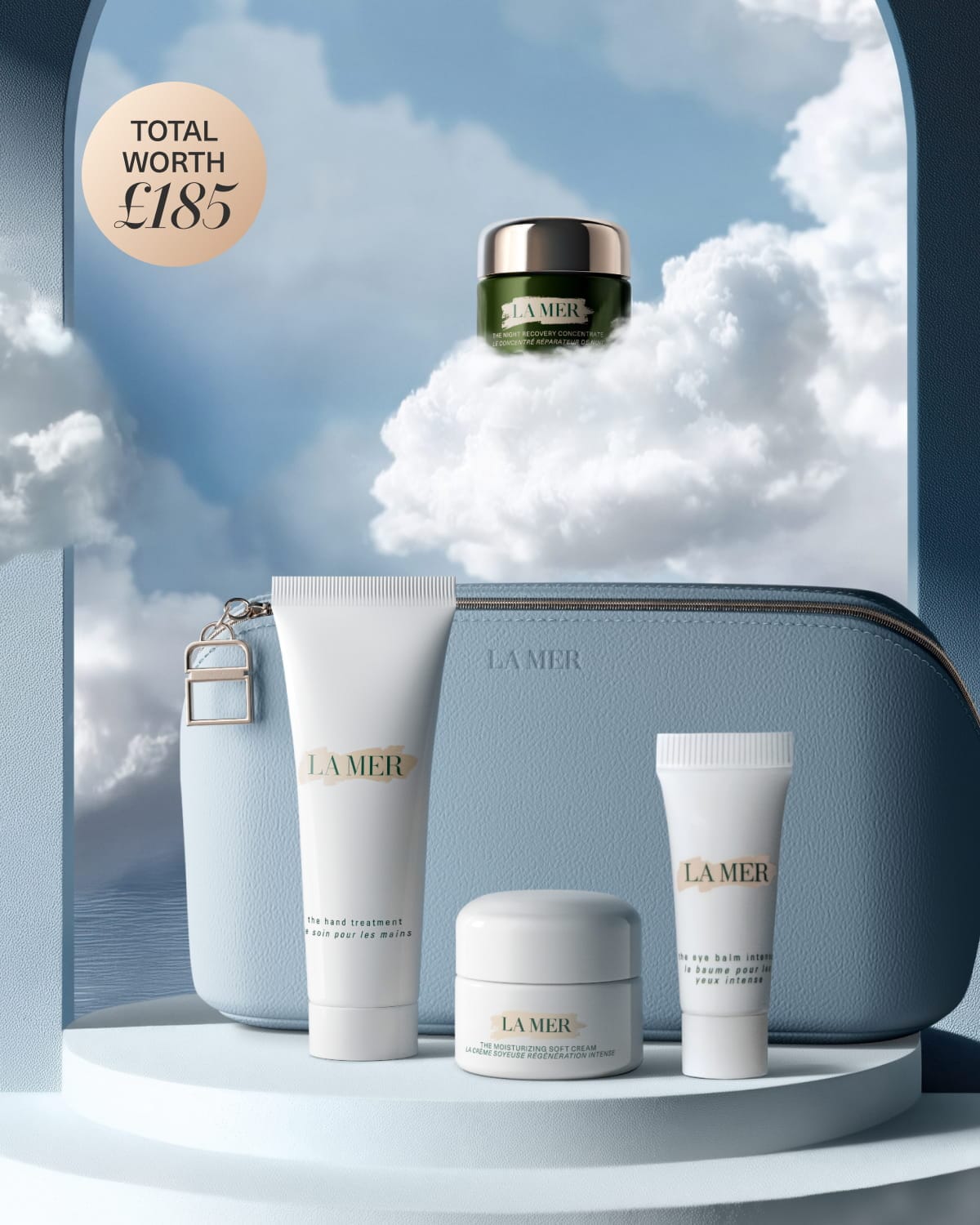 La Mer skincare gift set displayed on white blocks with a teal bag and products worth £242.