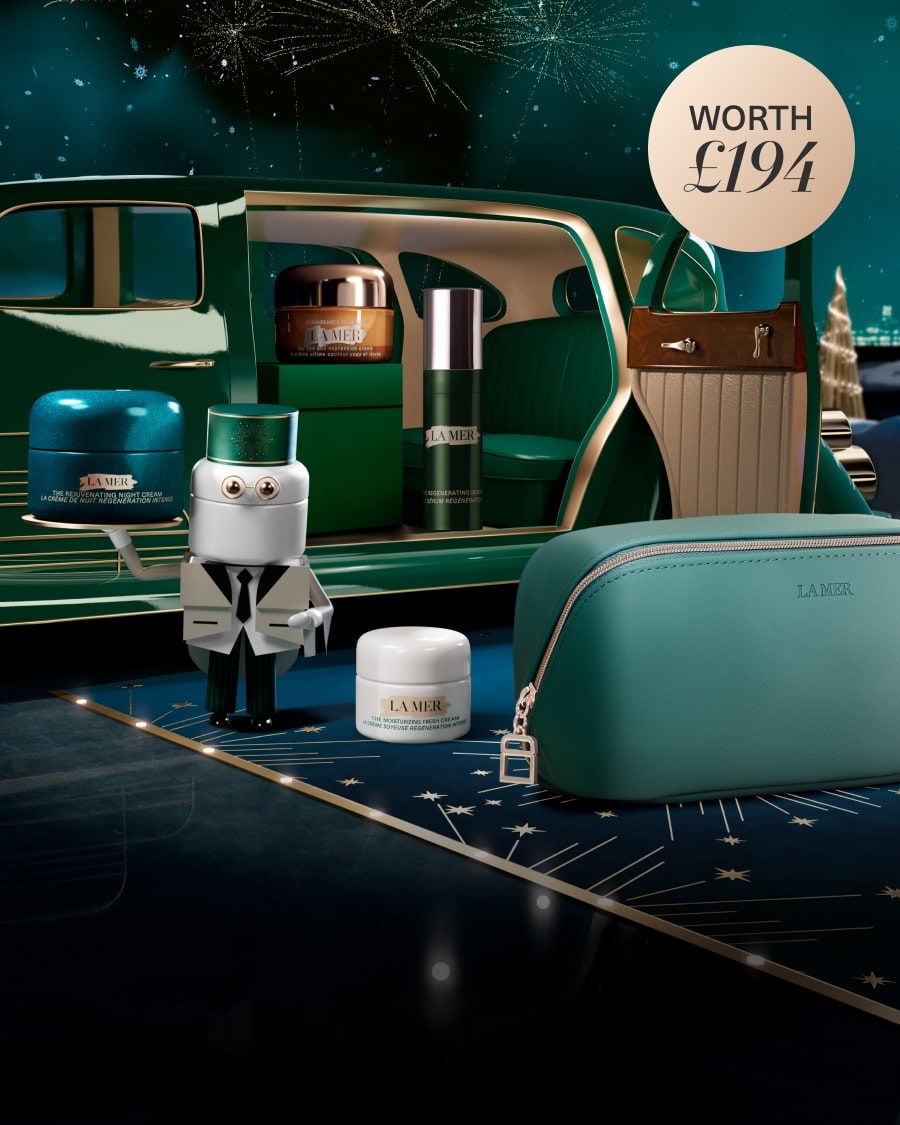 Selection of La Mer minis in a dynamic, twilight lit setting, with The Eye Concentrate mini on a glass shelf