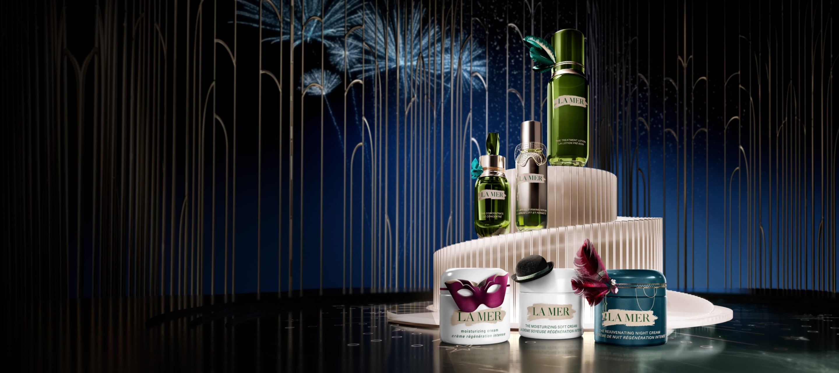 Selection of La Mer bestsellers, decorated in festive attire, in a grand setting with fireworks in the night sky beyhind