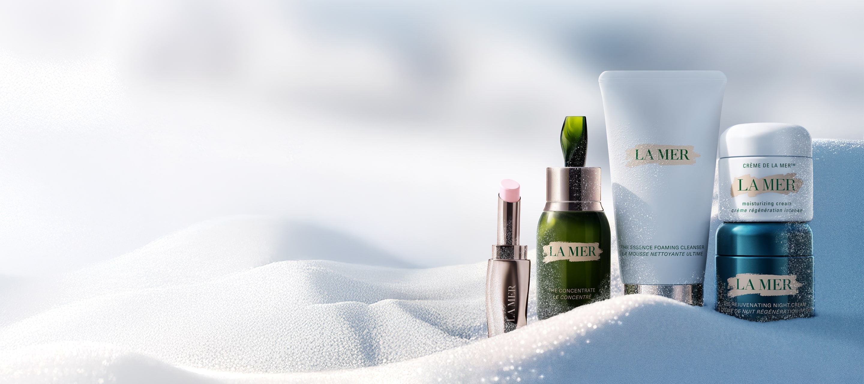 Selection of La Mer bestselling, nestled in snow, in an artic setting