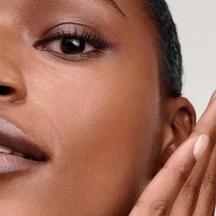 Close up of model applying skincare ritual